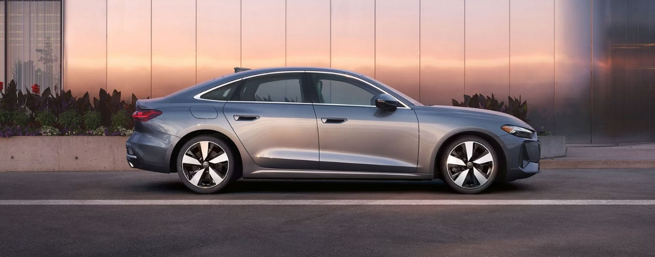 A grey 2025 Audi A5 for sale on a driveway.